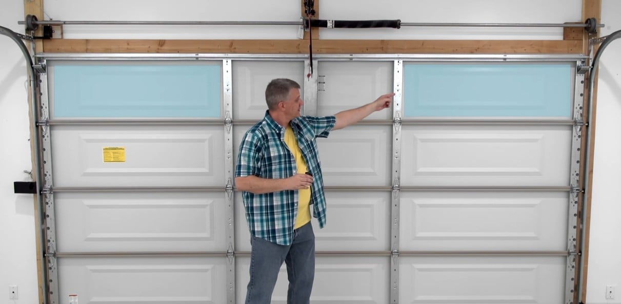 Choose the garage door’s top panel where you want to mount the sensor